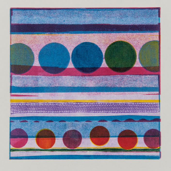 Shows a square image with bands of blue textured in various shades. The 2nd band has pinks and purple in various shades and contains 5 large circles in blues and greens. At the bottom of the image are 6 small circles in reds and pinks..
