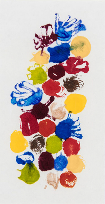 Shows a vertical image containing multi-colored circles and random shapes made from melted wax